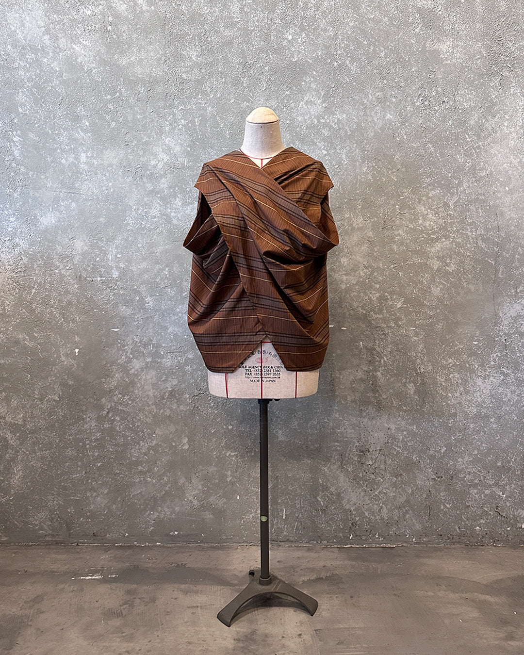 Cross drapery top in brown striped