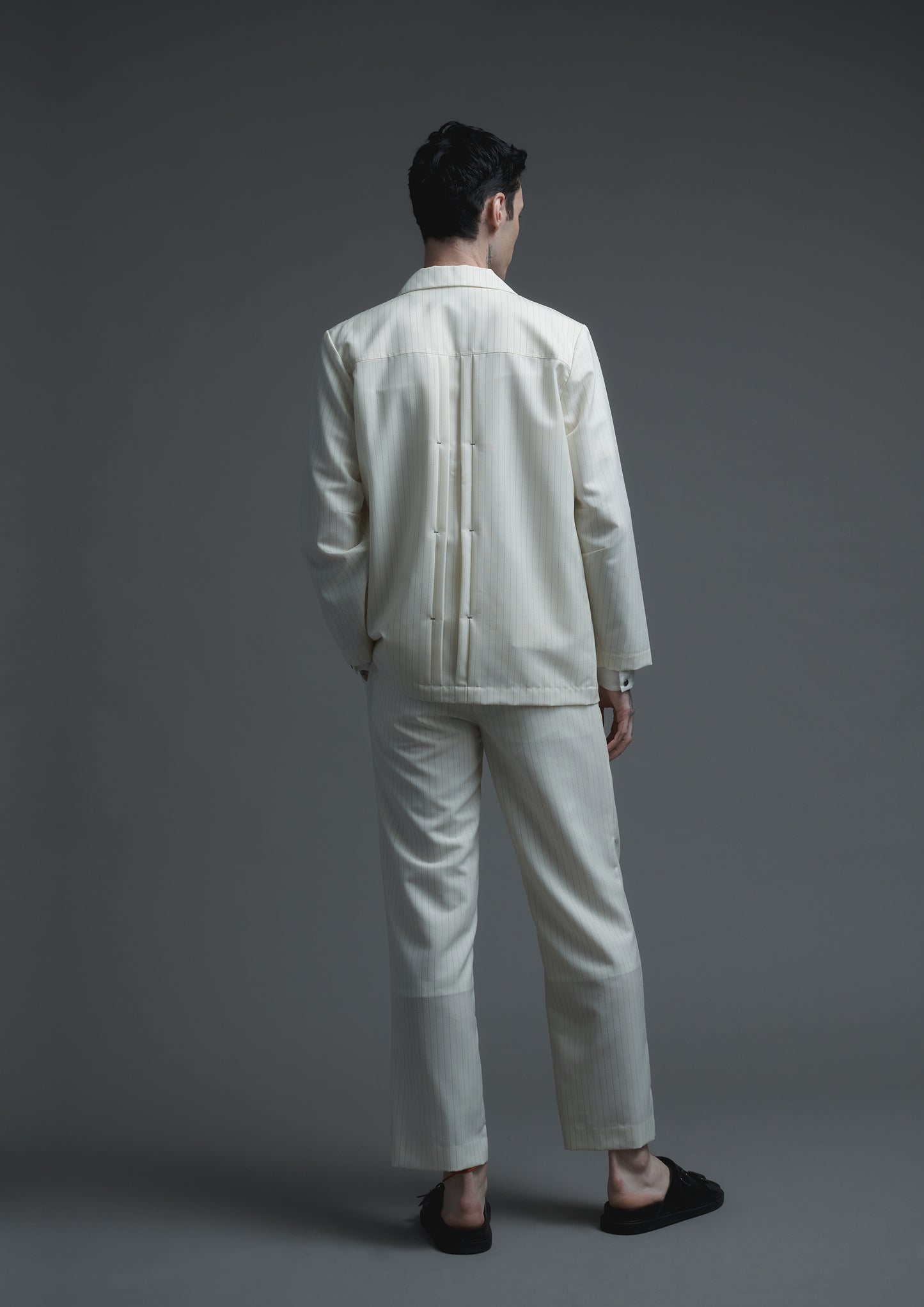 Patient pleated jacket in cream striped woolen suiting