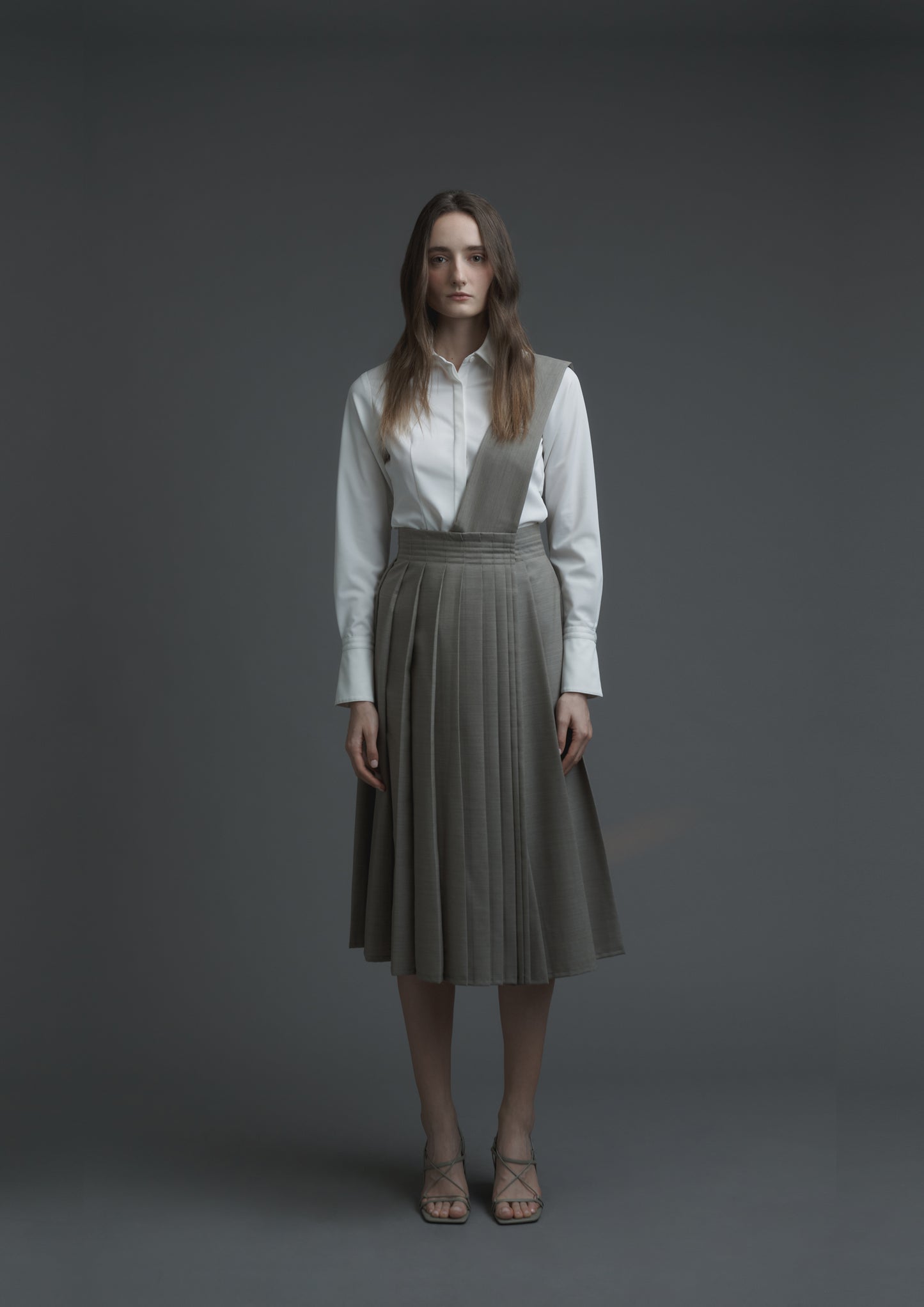 Uniform pleated skirt in beige striped suiting