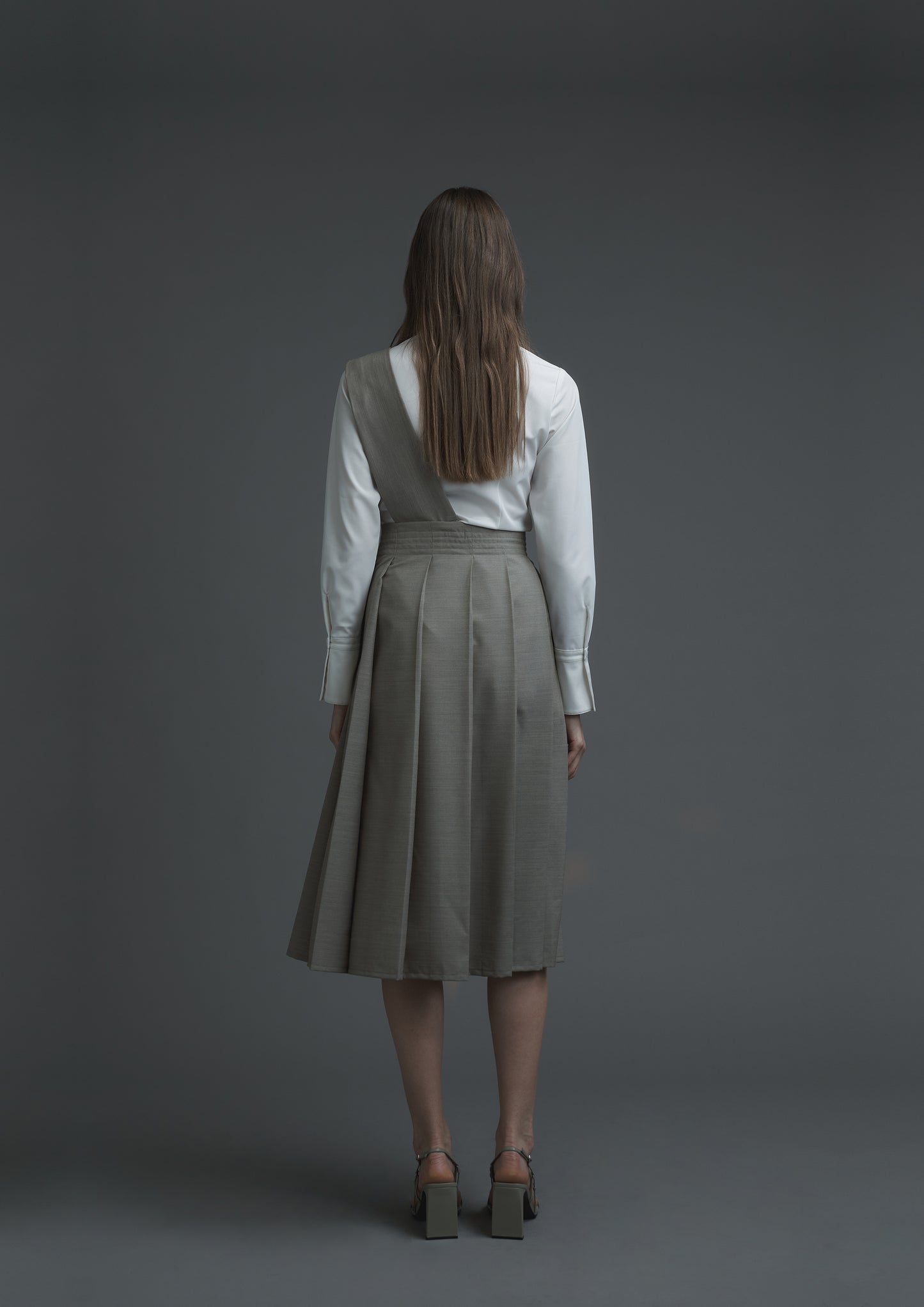 Uniform pleated skirt in beige striped suiting