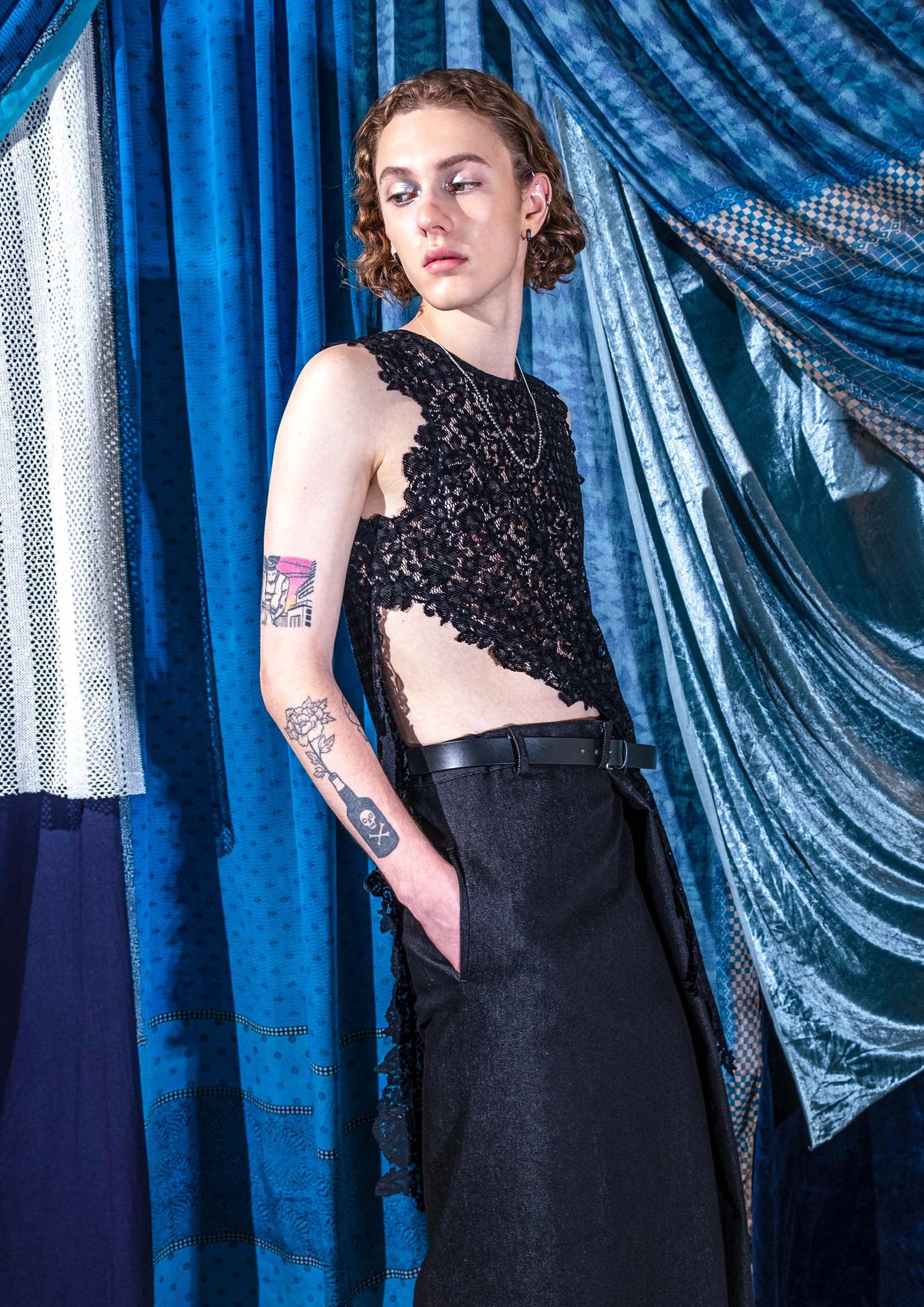 Close-up of handmade cut-outs on black velvet lace top