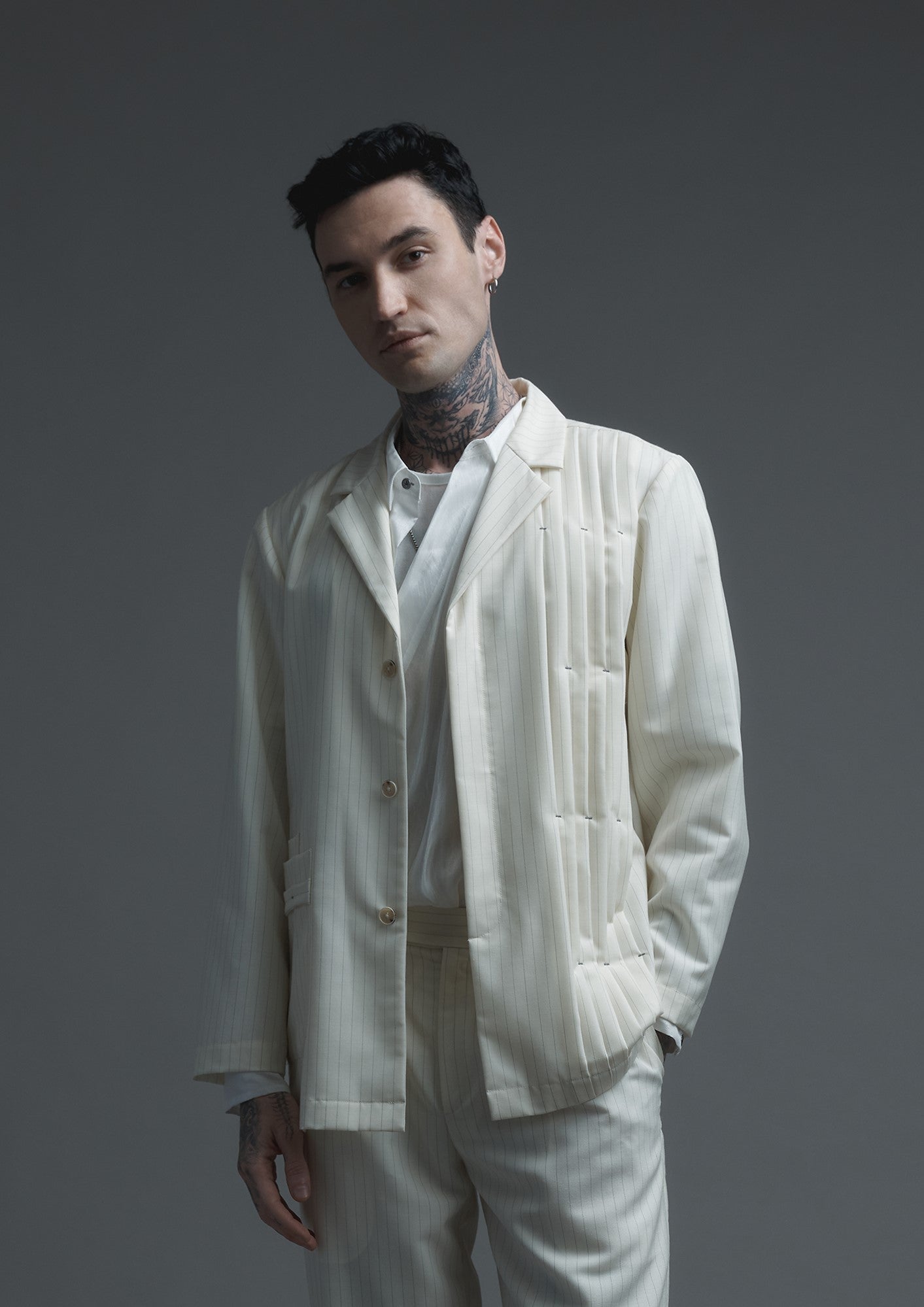 Patient pleated jacket in cream striped woolen suiting