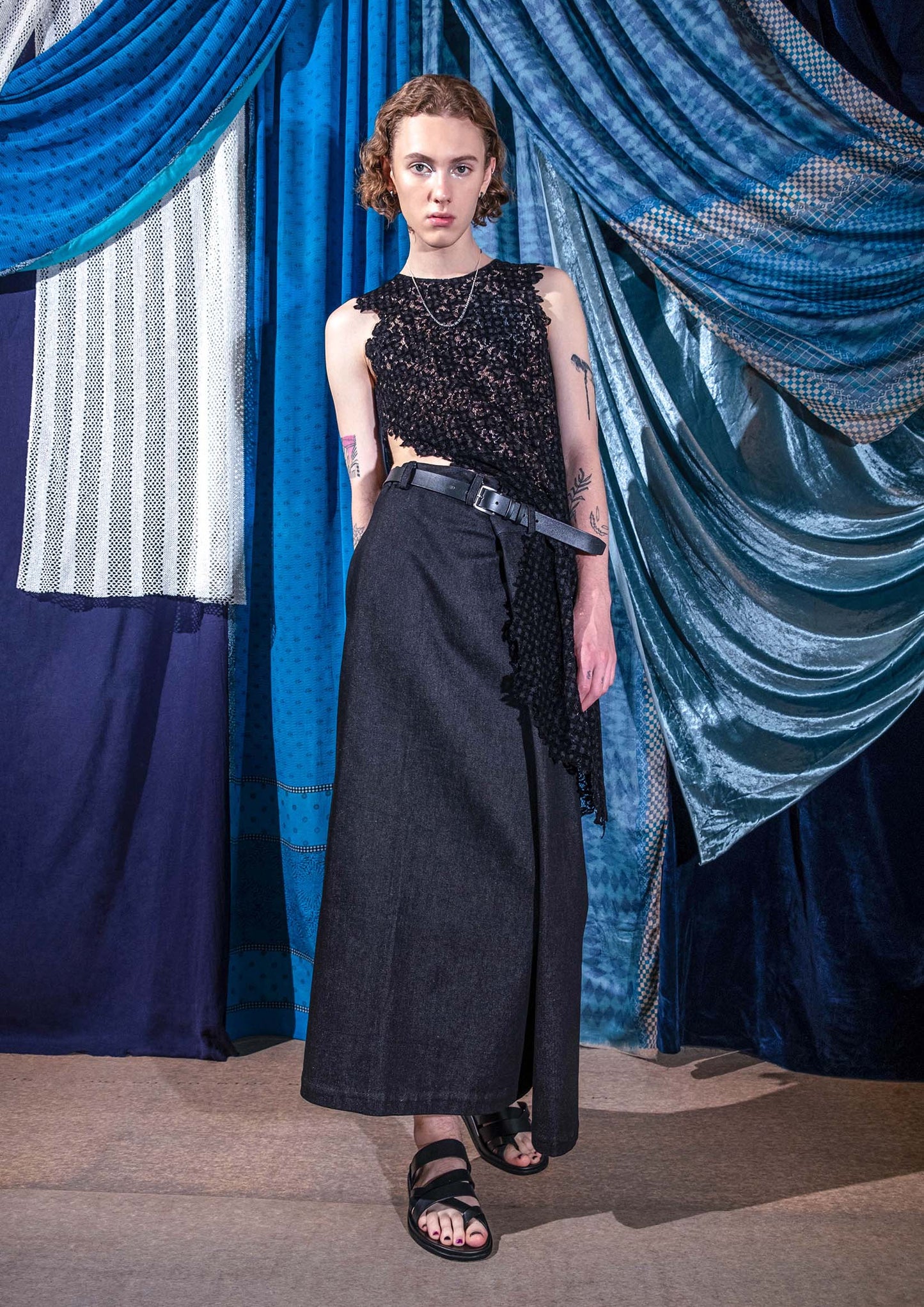 Front view of black asymmetric devoré velvet lace top with raw edge details